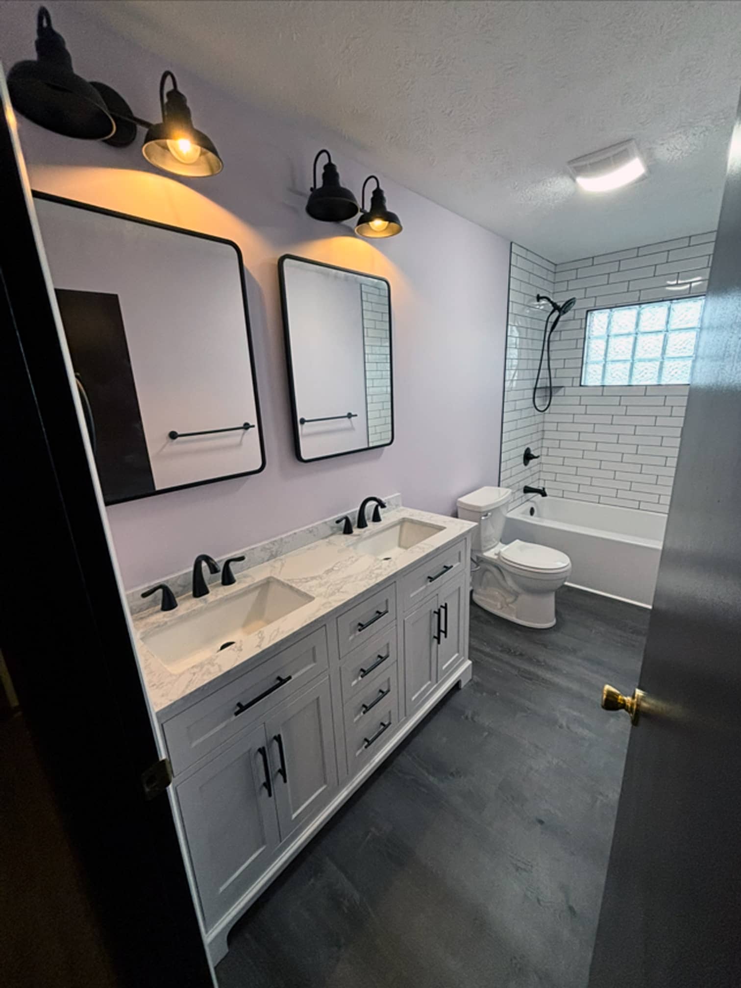 Double-sink bathroom vanity with contemporary fixtures in a Columbus-area home